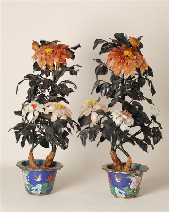 Appraisal: A Large Pair of Mixed Stone Floral Arrangements in matching