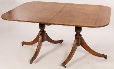 Appraisal: A George III mahogany twin-pedestal dining table each pedestal of