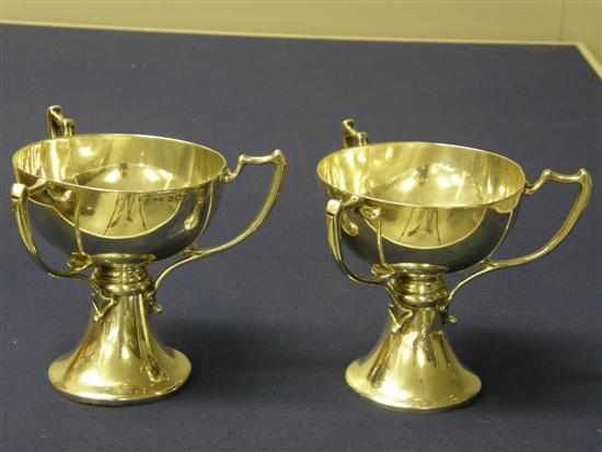 Appraisal: Pair of George V silver three handled trophy cups Birmingham