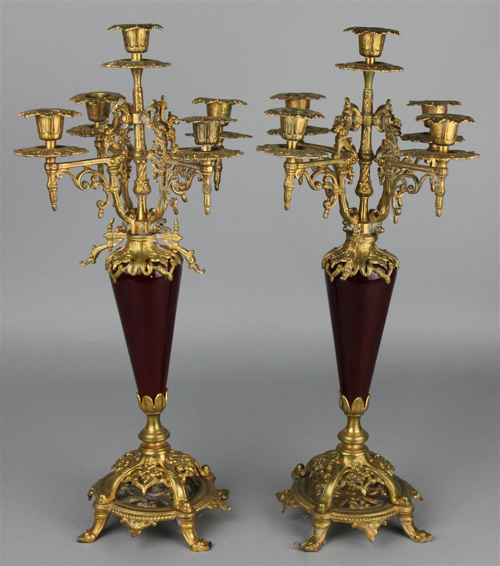 Appraisal: PAIR OF NAPOLEON III STYLE BRASS AND BURGUNDY PORCELAIN CANDELABRA