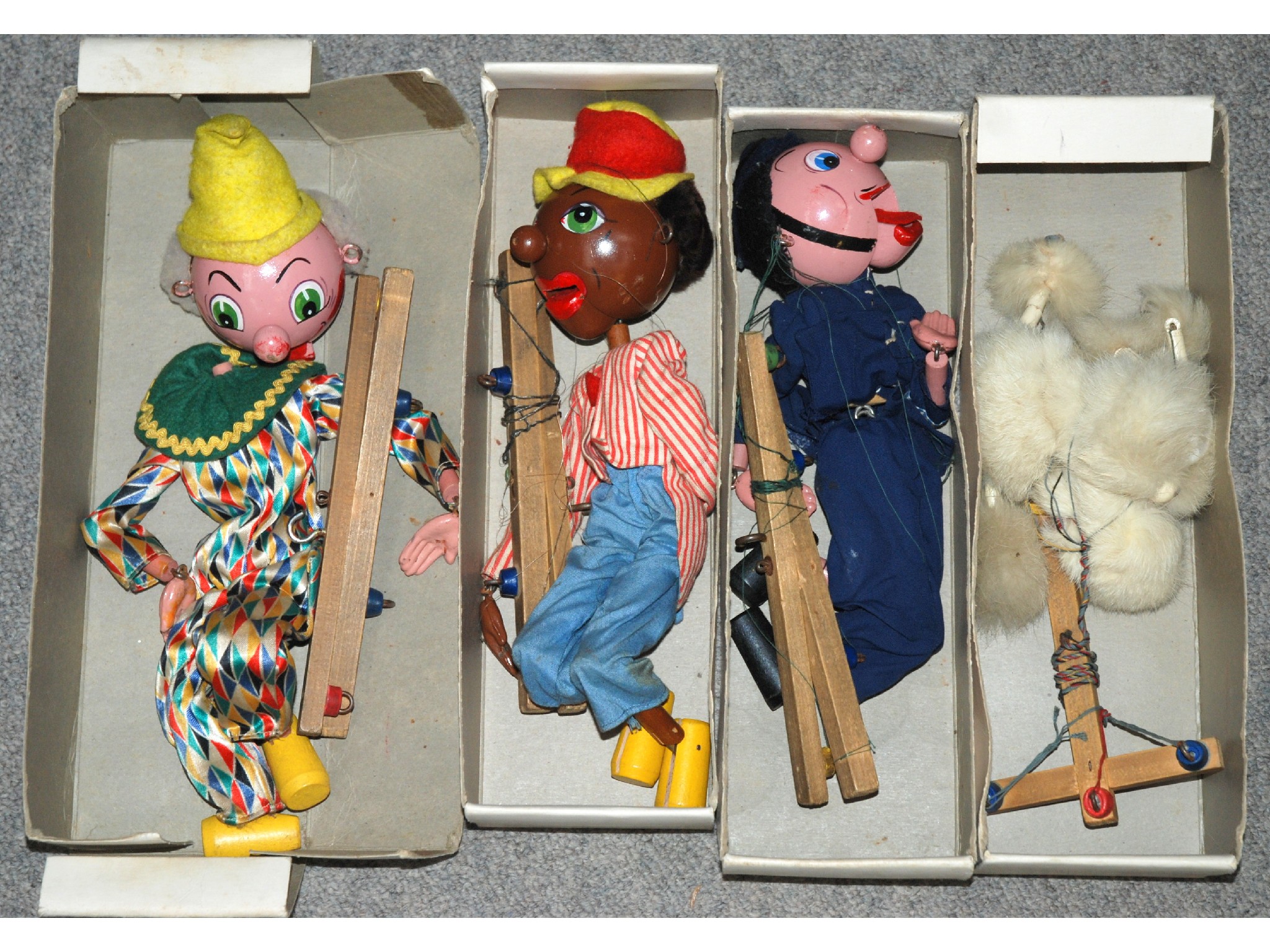 Appraisal: Four Pelham puppets including Poodle Clown all in original boxes