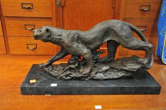 Appraisal: A CAST BRONZE OF A PANTHER ON A BLACK MARBLE