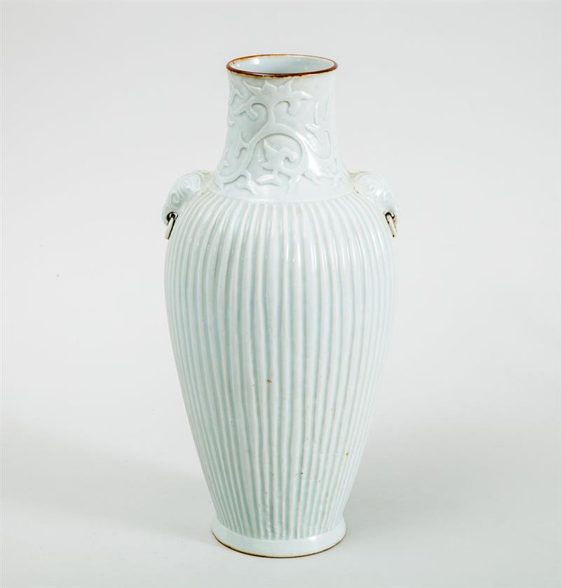 Appraisal: CHINESE IVORY-TO-CELADON GLAZED PORCELAIN VASE With double concentric circle mark