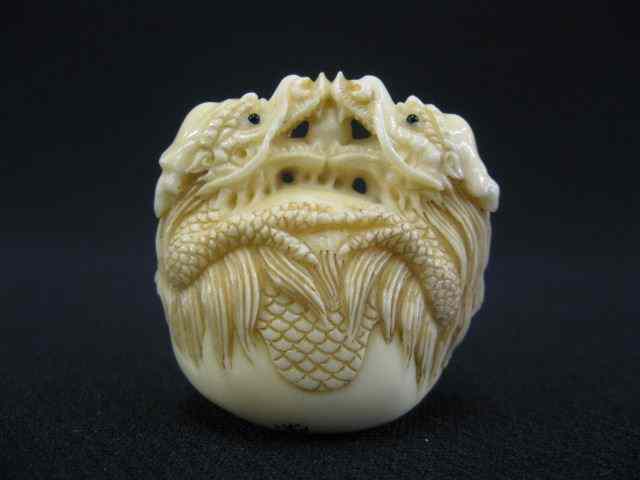 Appraisal: Carved Ivory Netsuke of Two Dragons fine signed ''