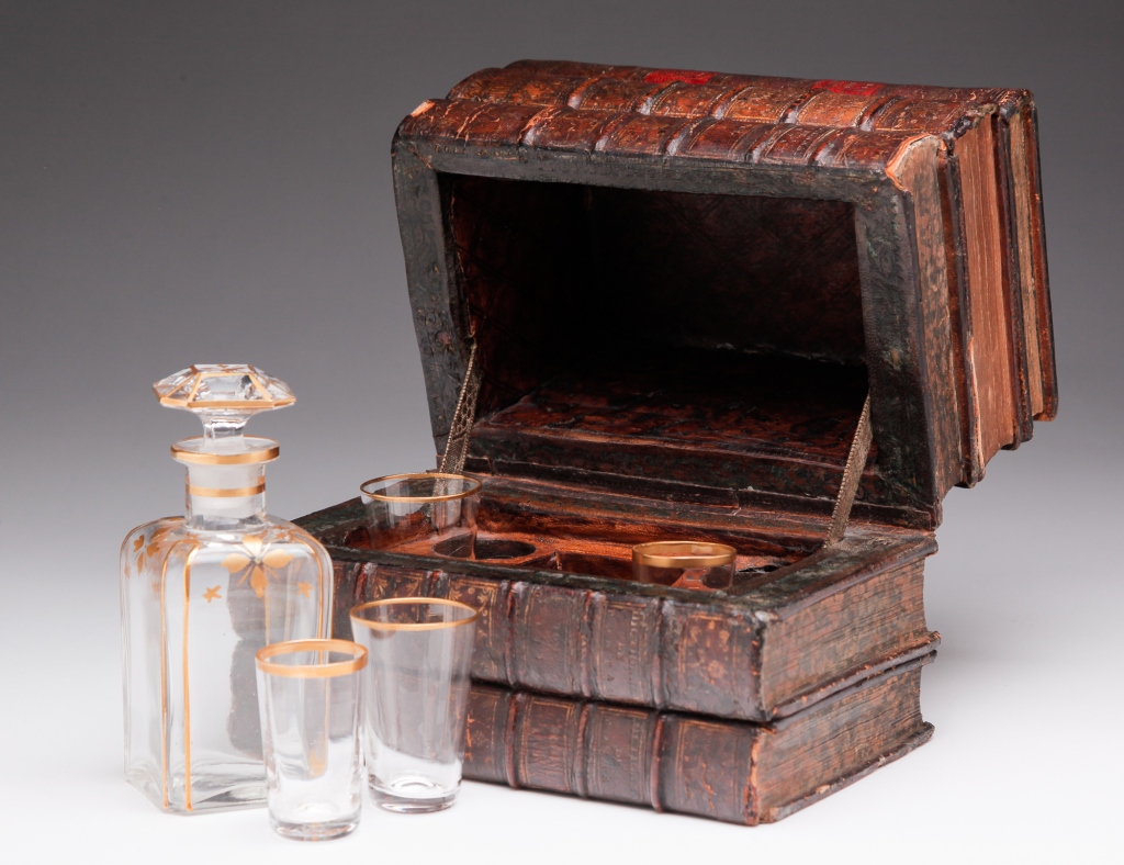 Appraisal: FRENCH DECANTER SET IN BOOK BOX Nineteenth century Stack of