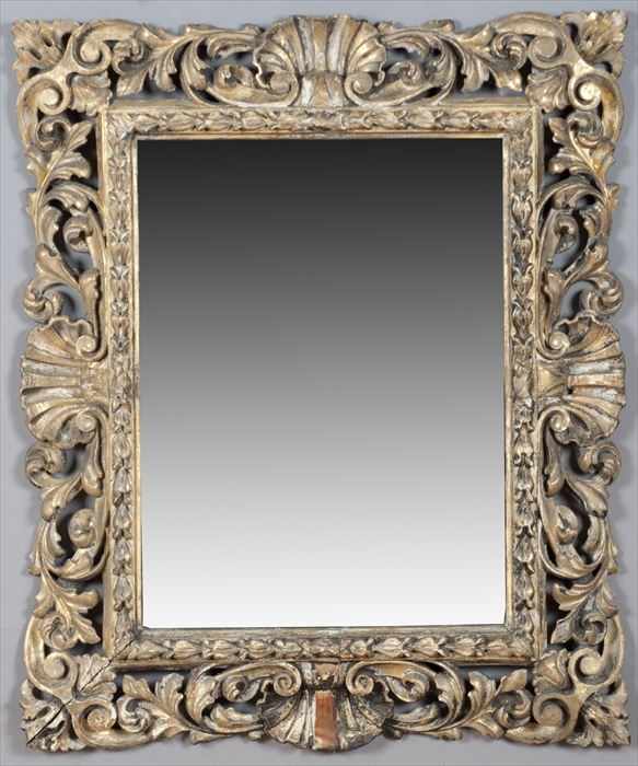 Appraisal: SPANISH BAROQUE-STYLE CARVED GILTWOOD WALL MIRROR The rectangular mirror plate