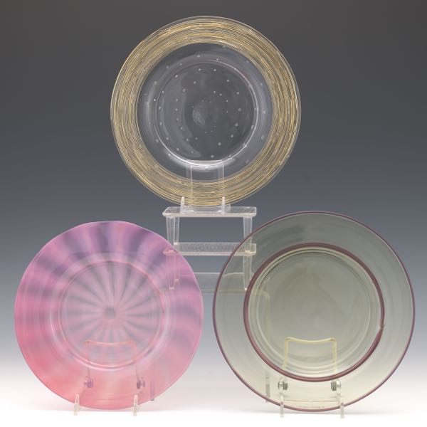 Appraisal: NINE STEUBEN PLATES approximate diameter Nine Steuben glass plates varying