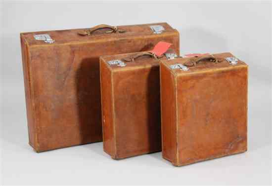 Appraisal: Three tan leather automobile cases with watered silk lining largest