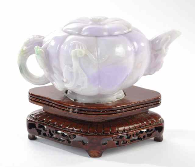 Appraisal: CHINESE QING DYNASTY CARVED LAVENDER JADEITE TEAPOT having stylized dragon