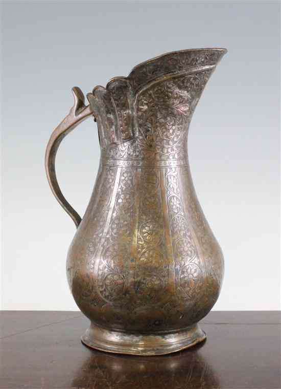 Appraisal: An Islamic tinned copper ewer th th century cast and