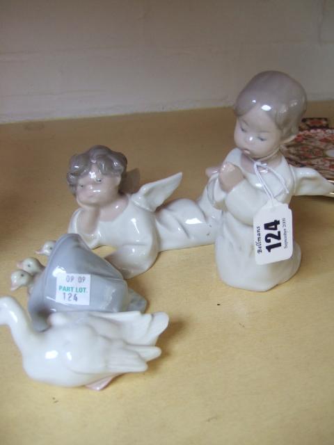 Appraisal: Three Lladro figures including two winged cherubic figures and a