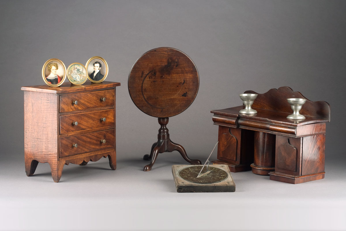 Appraisal: MINIATURE QUEEN ANNE MAHOGANY TILT TOP TEA TABLE The circular