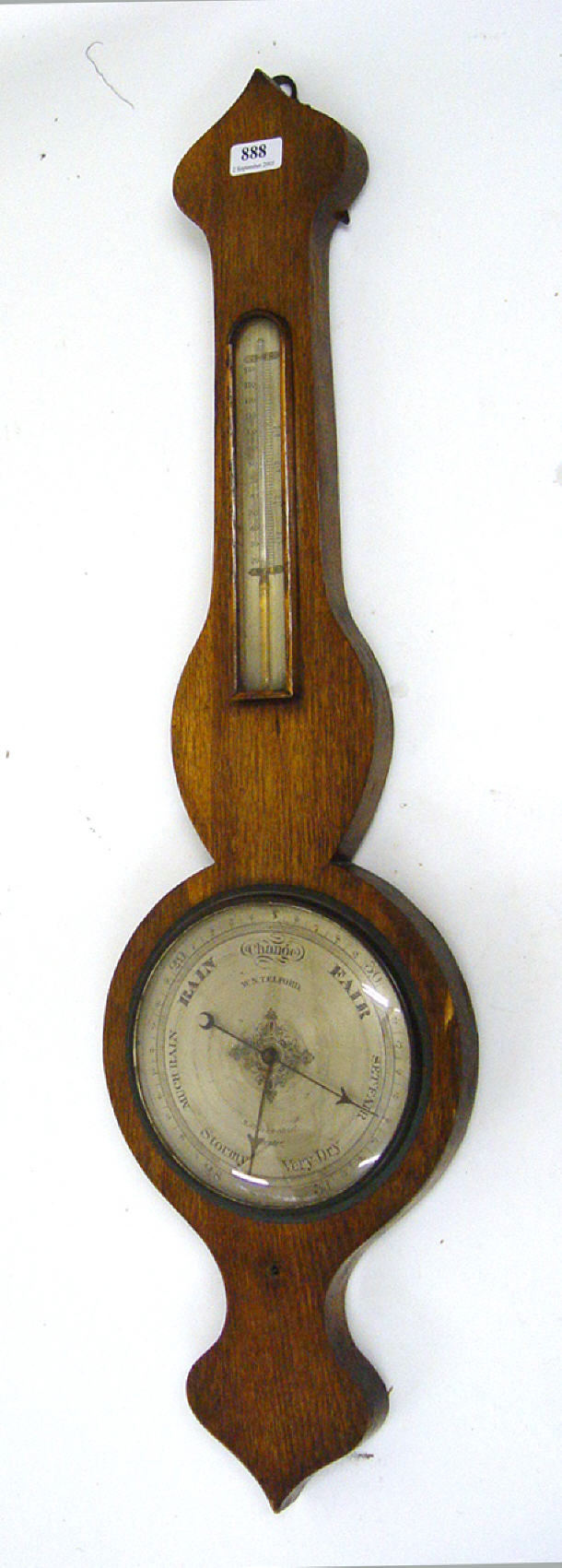 Appraisal: Oak wheel barometer with thermometer panel the dial inscribed W