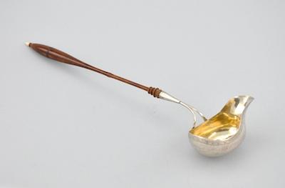 Appraisal: A Continental Silver Punch Ladle with Wooden Handle The bowl