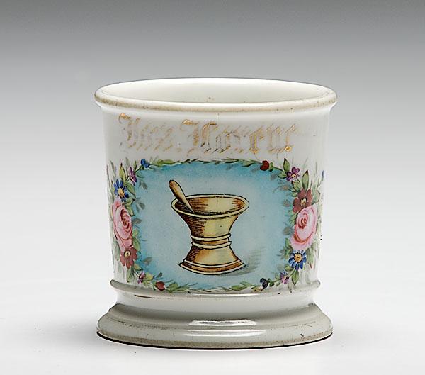 Appraisal: PHARMACIST'S OCCUPATIONAL SHAVING MUG porcelain with polychrome painted scene of