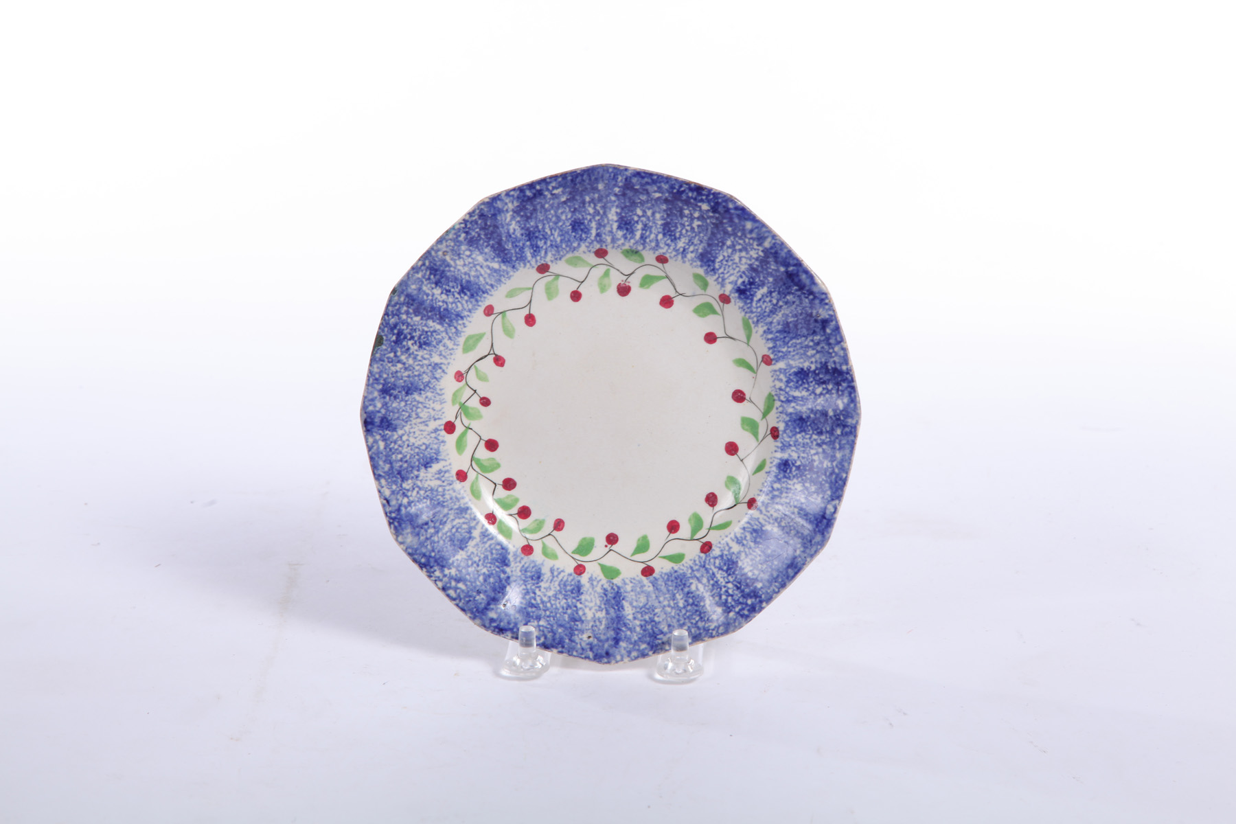 Appraisal: SPATTERWARE PLATE England nd quarter- th century Blue with Hollyberry