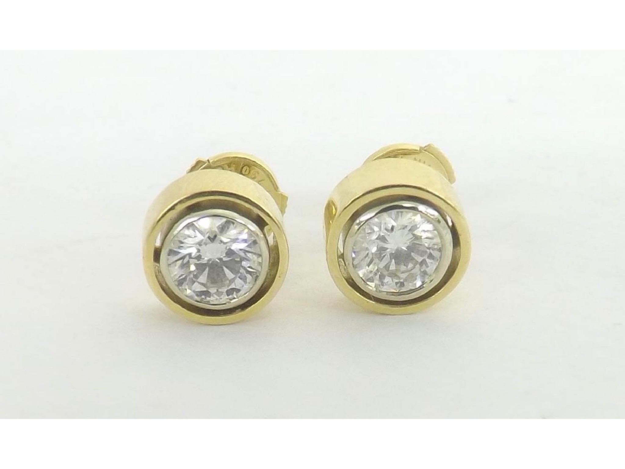 Appraisal: -a Pair of round brilliant-cut diamond ear studs in yellow