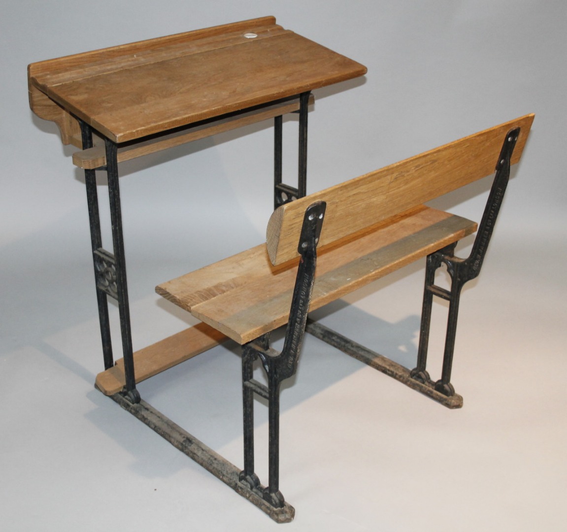 Appraisal: A thC Polytechnic light wood and iron framed school desk