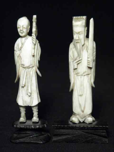 Appraisal: Two Chinese carved ivory figures Both depict elderly robed figures