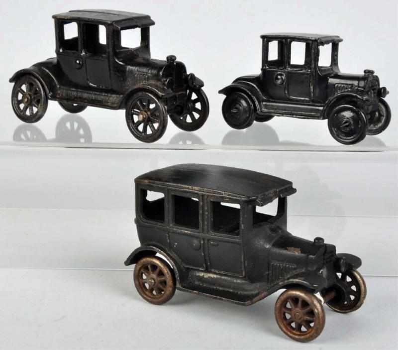 Appraisal: Lot of Cast Iron Arcade Model A T Auto Toys