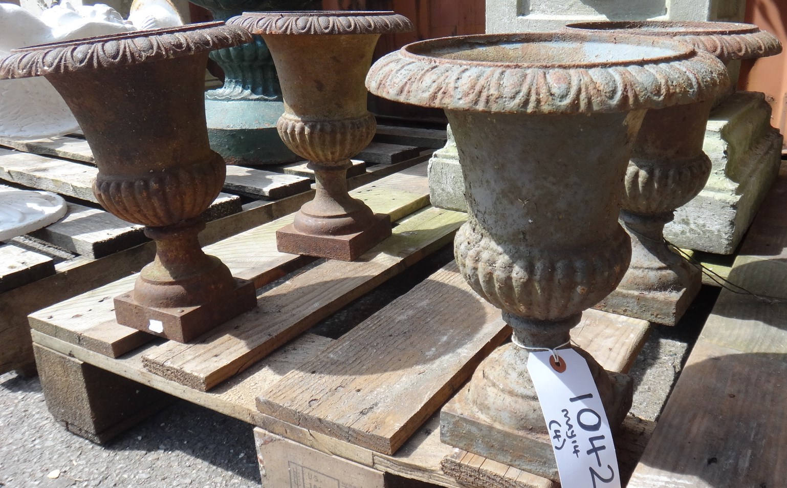 Appraisal: A set of four small cast iron baluster urns with