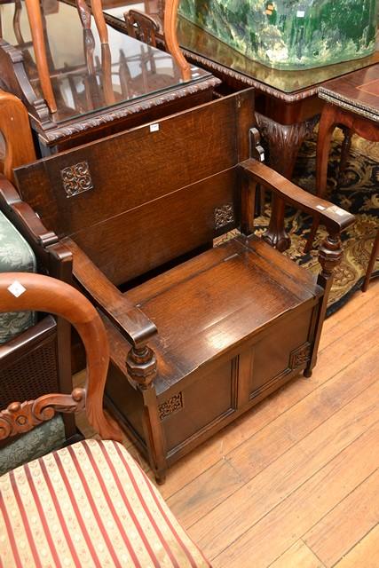 Appraisal: AN OAK MONKS SEAT WITH ORNATE CARVING AN OAK MONKS