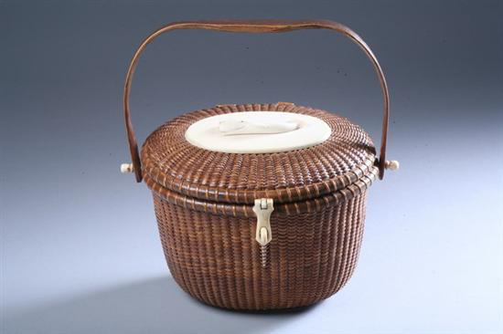 Appraisal: NANTUCKET BASKET PURSE mid- th century Oval with swing handle