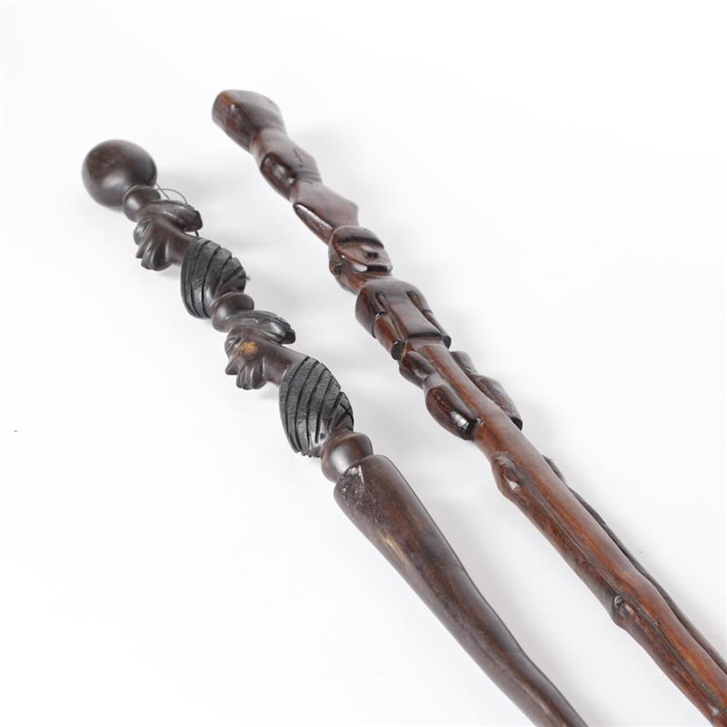 Appraisal: Two African carved figural hardwood walking canes with inlay Zimbabwe