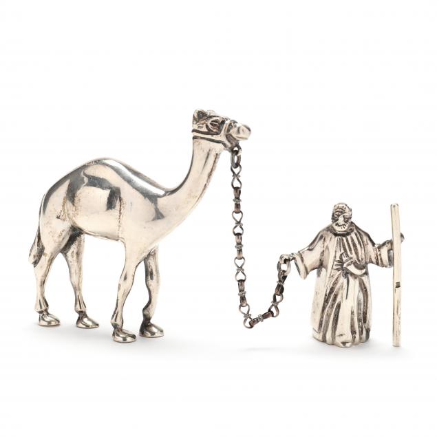 Appraisal: A VINTAGE EGYPTIAN SILVER MODEL OF A BEDOUIN WITH CAMEL