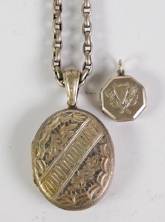 Appraisal: VICTORIAN SILVER OVAL LOCKET PENDANT floral and foliate scroll engraved