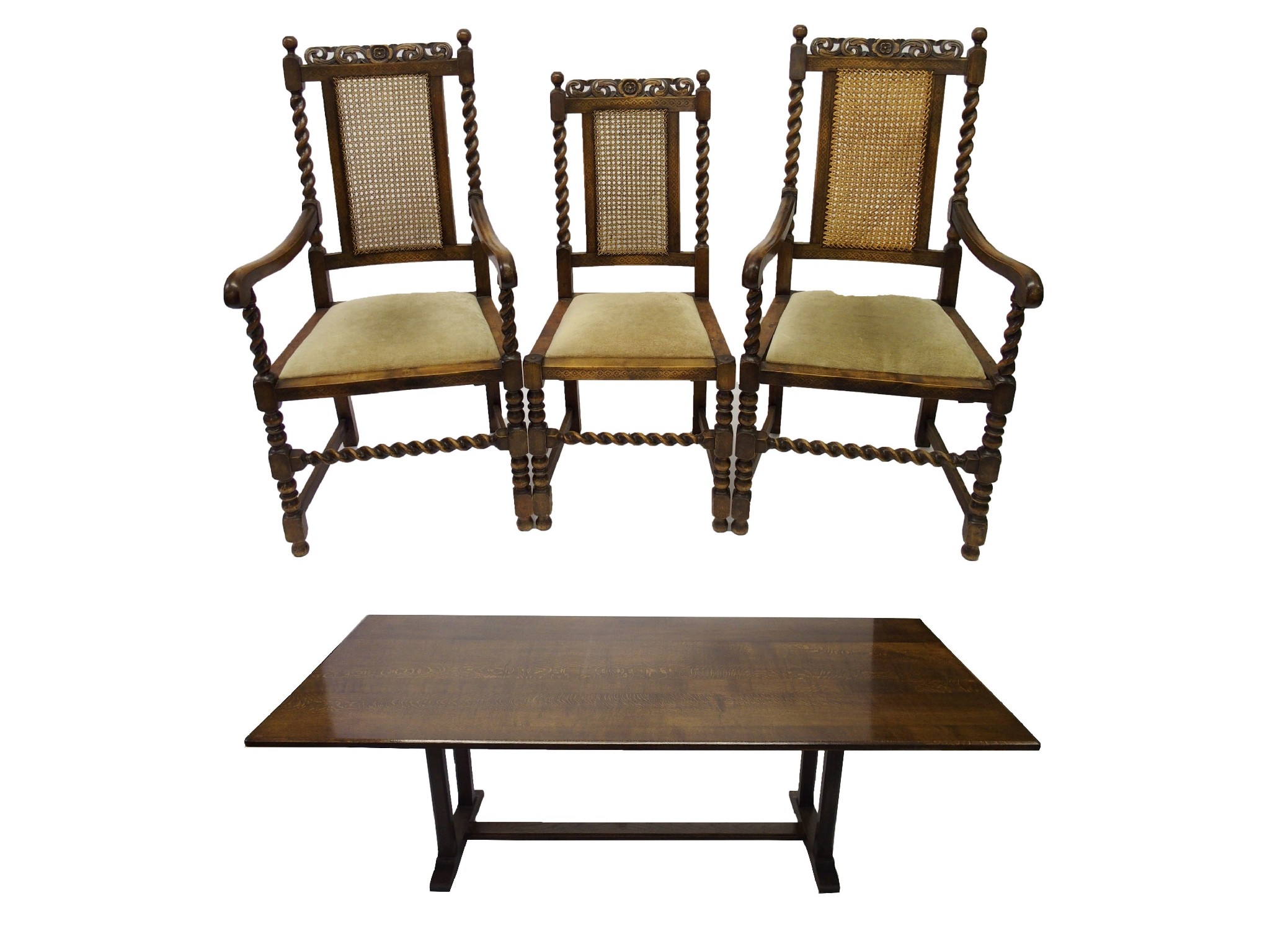 Appraisal: A Baronial style oak dining tableeight chairs each rail carved