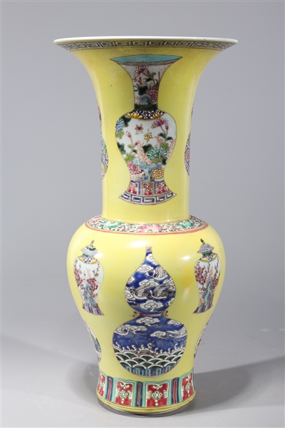 Appraisal: Chinese famille rose enameled porcelain yellow ground vase with vase