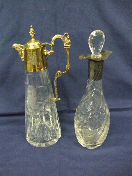 Appraisal: Silver gilt mounted claret jug with scroll handle and engraved