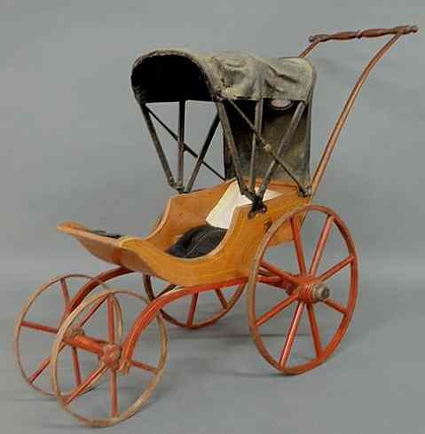 Appraisal: Child's doll carriage th c the black leather top with