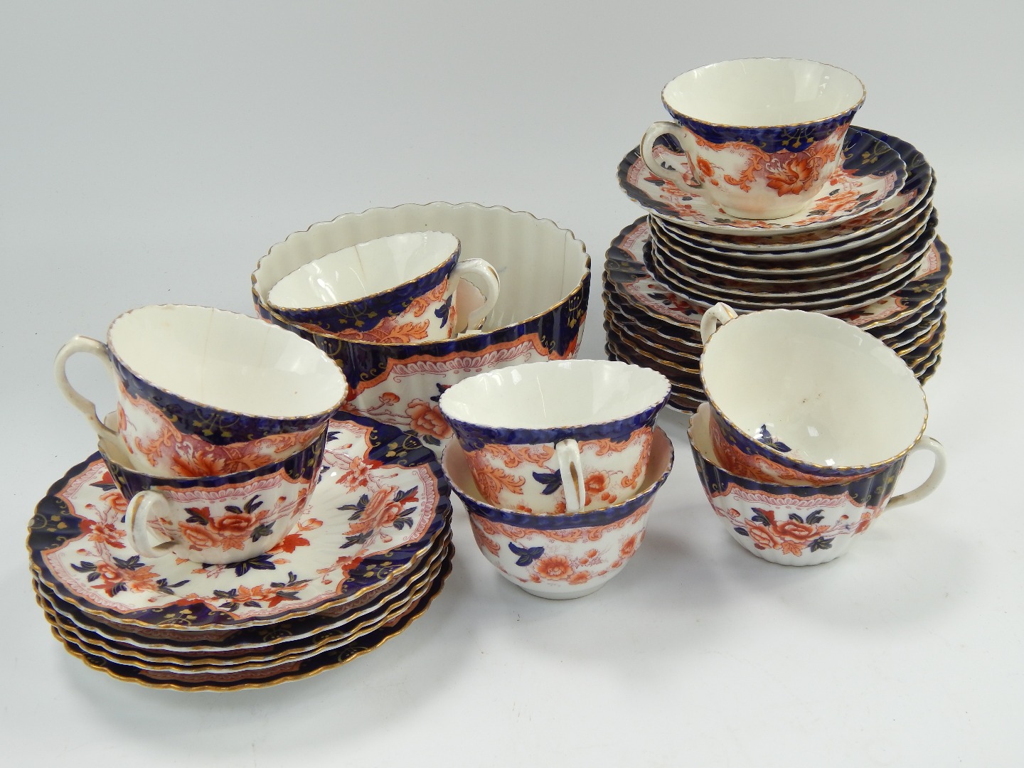 Appraisal: A Crown Staffordshire part tea service with Imari pattern decoration