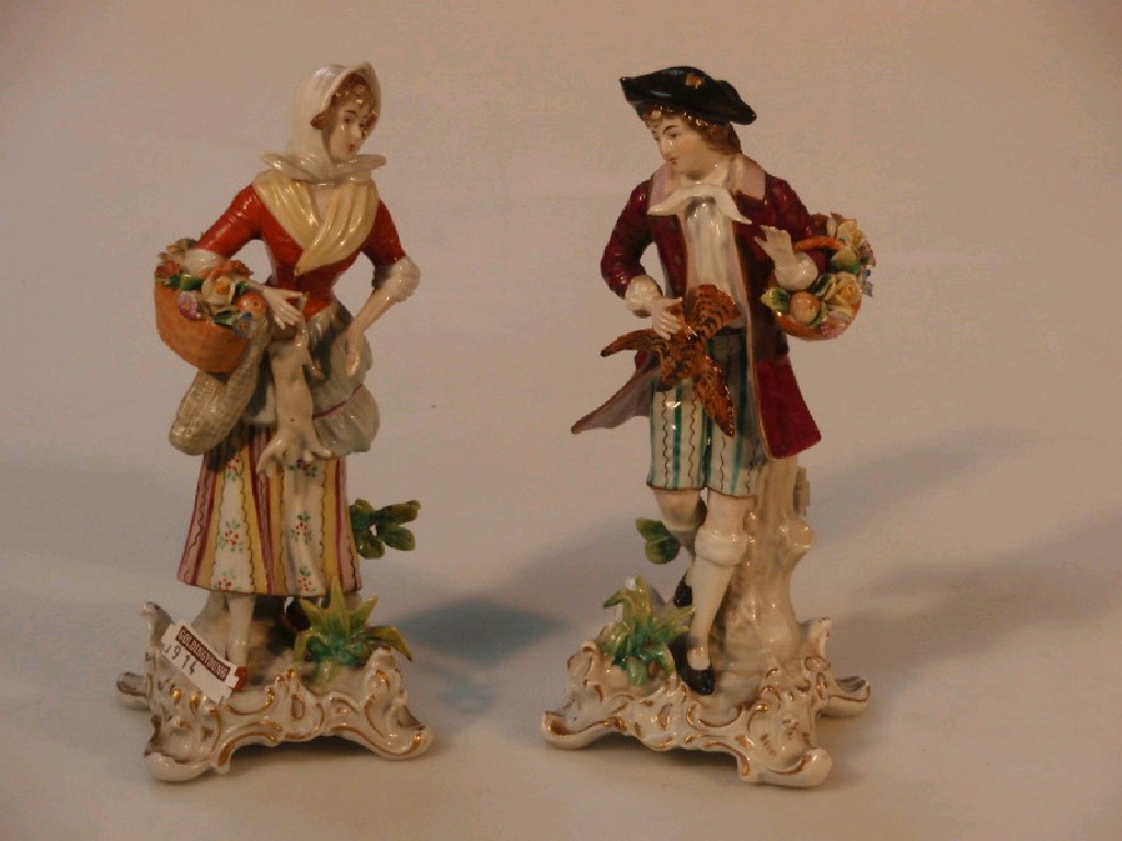 Appraisal: A pair of Sitzendorf porcelain figures of a man and