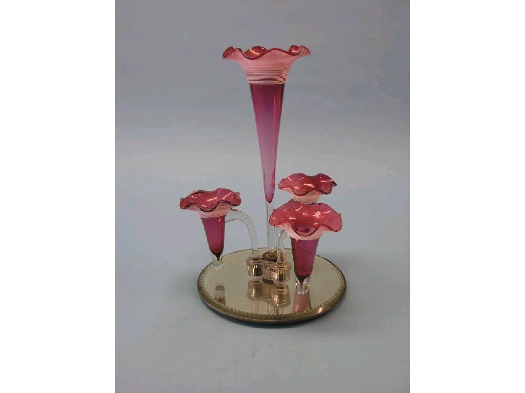 Appraisal: A Victorian cranberry glass epergne central trumpet vase and three