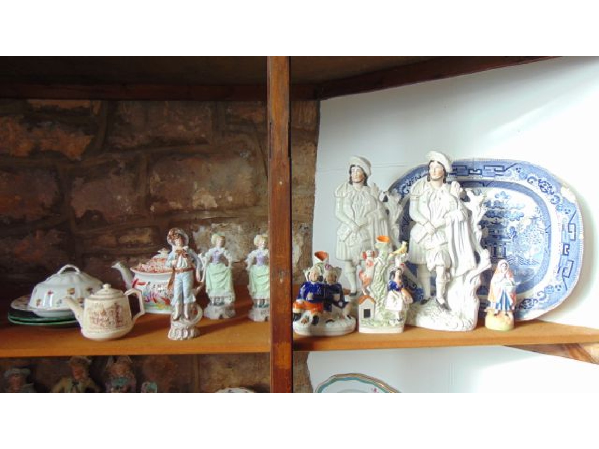 Appraisal: A collection of th century Staffordshire figures including a pair