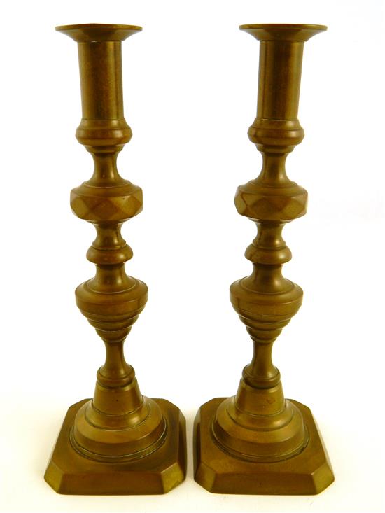 Appraisal: Pair brass candlesticks ring diamond and beehive motifs square bases