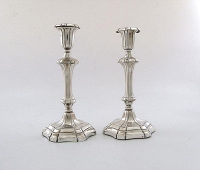 Appraisal: A pair of William IV silver candlesticks of tapering shaped