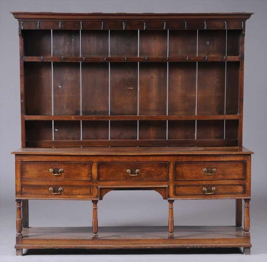 Appraisal: VICTORIAN OAK WELSH DRESSER The molded cornice above wrought-iron hooks