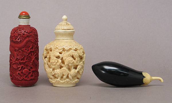 Appraisal: Three snuff bottles The first a molded cinnabar lacquer bottle