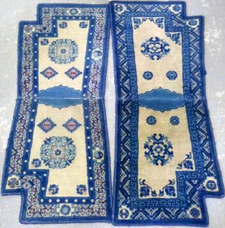 Appraisal: Five Chinese woollen saddle carpets cream ground with blue borders