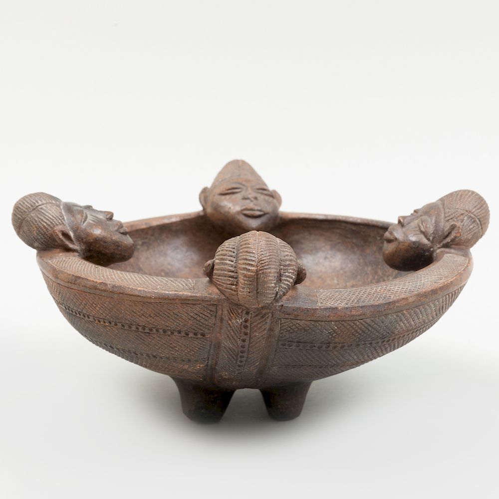 Appraisal: West African Burnished Brown Pottery Bowl Modeled on the rim