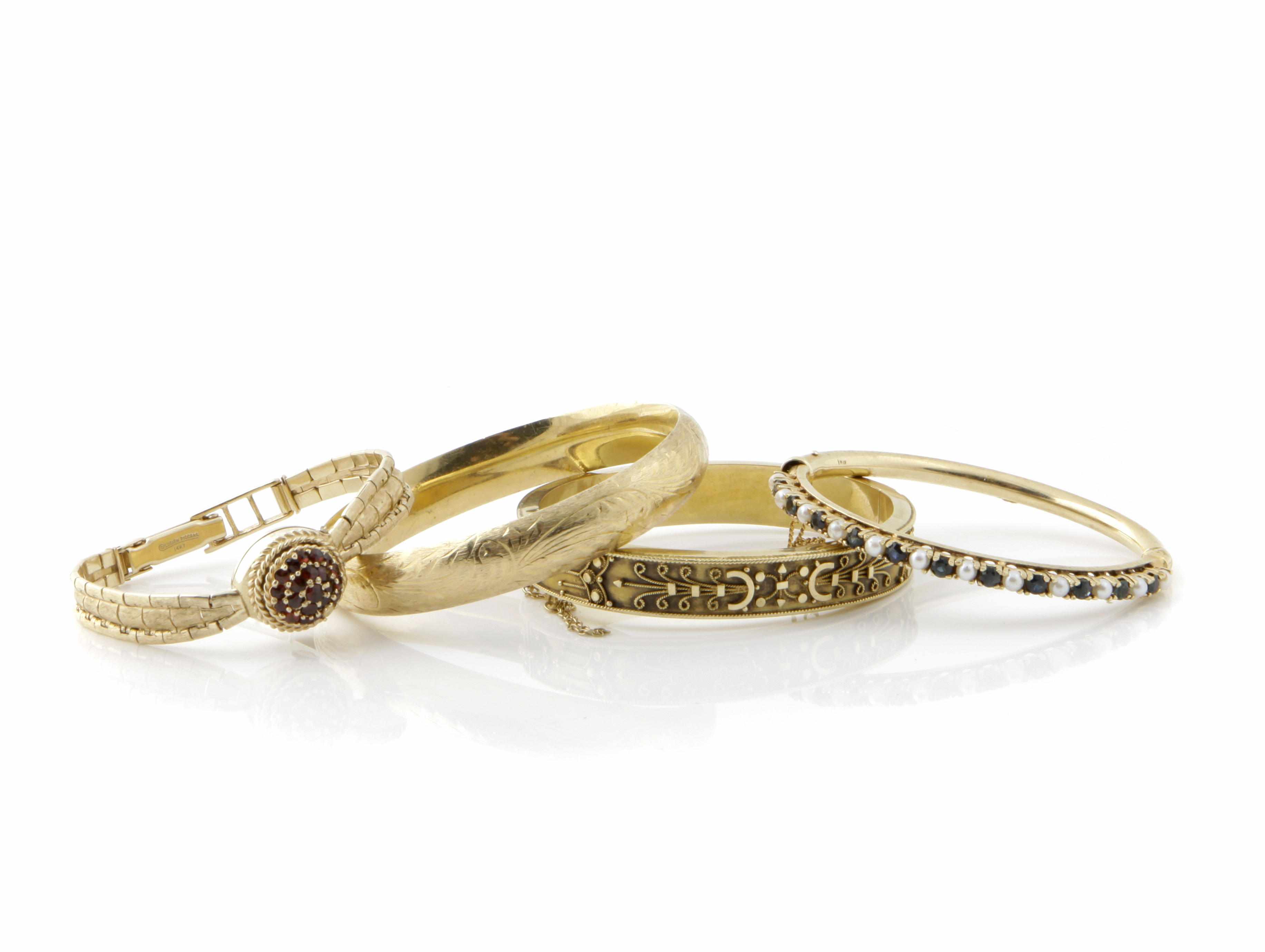 Appraisal: A group of gem-set and gold bracelets comprising bangles and