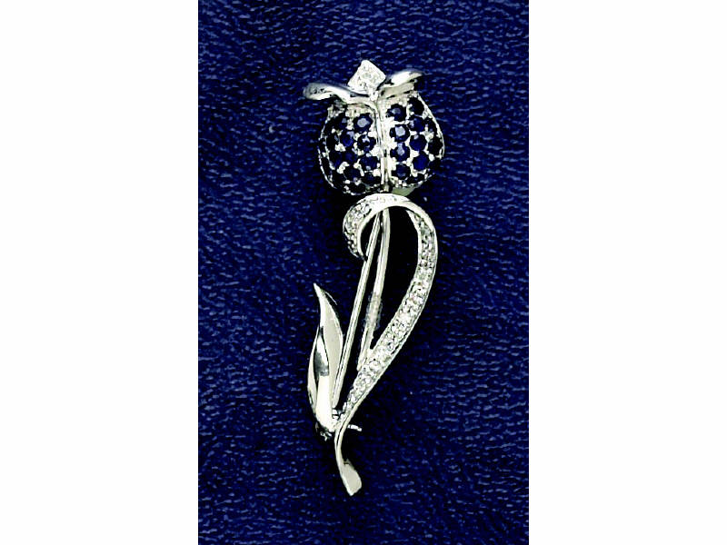 Appraisal: SAPPHIRE BROOCH k white gold floral design brooch set with