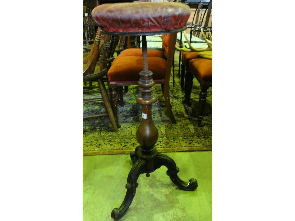 Appraisal: A Victorian mahogany music stool of circular form raised on