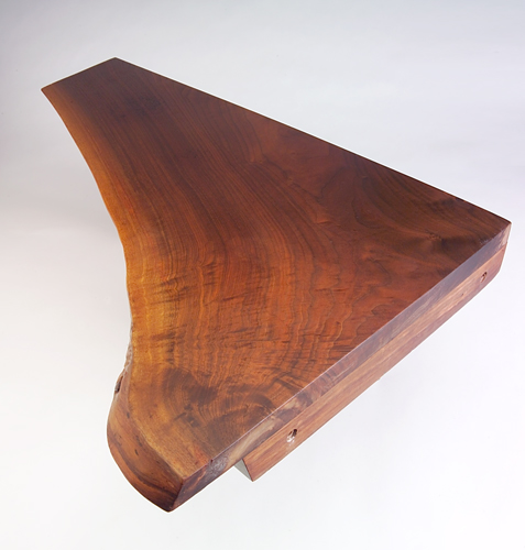 Appraisal: GEORGE NAKASHIMA Walnut corner shelf with free edge front and