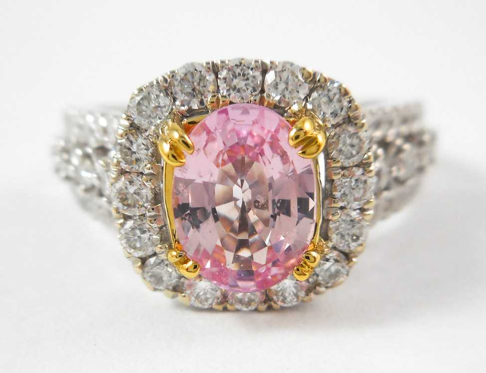 Appraisal: PINK SAPPHIRE DIAMOND AND FOURTEEN KARAT GOLD RING The white