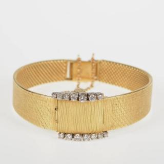 Appraisal: Bucherer lady's K yellow gold diamond watch th c hidden